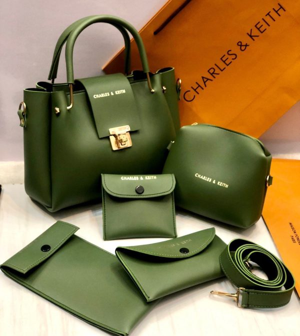 Set of green handbags and accessories with 'Charles & Keith' branding on a light background.