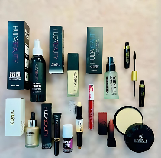 Collection of Huda Beauty and Iconic makeup products on a light background