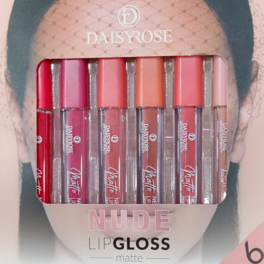 Set of DaisyRose nude lip glosses in a packaging with a blurred background